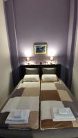Posteľ alebo postele v izbe v ubytovaní Olive Tree City Apartment