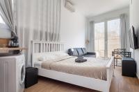 Posteľ alebo postele v izbe v ubytovaní CAMP NOU & FiRA BUSINESS LOFTS