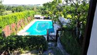 an overhead view of a swimming pool in a vineyard at Les Bigoussies in Ribérac