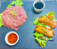 a blue plate of food with a sandwich and sauce at Sublime Tahiti Beach Retreat in Mataiea