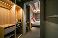 a small bedroom with a bed and a closet at Hotel La Pau in Barcelona