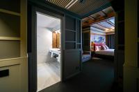 a door leading into a room with a bedroom at Hotel La Pau in Barcelona