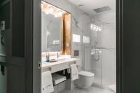 a bathroom with a sink and a toilet and a shower at Hotel La Pau in Barcelona