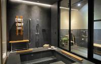 a large bathroom with a shower and a sink at Onsen Papawaqa in Tai&#39;an