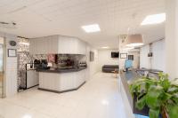 A kitchen or kitchenette at Hotel Santa Faz
