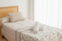A bed or beds in a room at Hotel Santa Faz