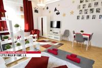 Televízia a/alebo spoločenská miestnosť v ubytovaní Little Americas Ring Apartments