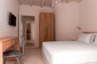 Postel nebo postele na pokoji v ubytování Senses Luxury Suites & Villas