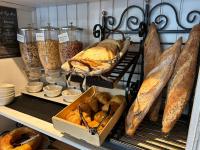 a bakery with lots of different types of bread at Hotel Ty Gwenn La Baule in La Baule