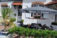 a hotel ivy tavern umbrella in front of a building at Hotel Ty Gwenn La Baule in La Baule