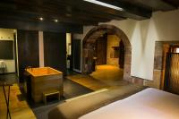 A bed or beds in a room at Hotel Boutique El Convento de Mave
