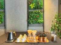 a table with a bunch of cups and pitchers at HOTEL SUI AKASAKA by ABEST in Tokyo