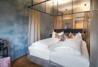 Postel nebo postele na pokoji v ubytování Hotel Schachner