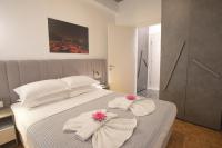 A bed or beds in a room at Aonia Luxurious Modern Boutique Apartments