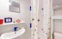 a bathroom with a shower and a toilet and a sink at 4 Bedroom Cozy Home In Royan in Royan