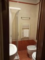 a bathroom with a sink and a toilet at Hotel Henry in Venice