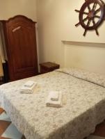 a bedroom with a bed with two towels on it at Hotel Henry in Venice