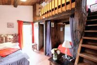 a bedroom with a bunk bed and a staircase at Maison d&#39;une chambre avec jardin clos a Tour de Faure in Tour-de-Faure