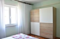 Posteľ alebo postele v izbe v ubytovaní Apartman Miki