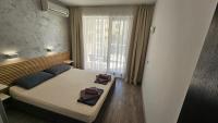 Postel nebo postele na pokoji v ubytování Horizont Apartment Sozopol