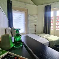 Een bed of bedden in een kamer bij Hotel 't Witte Huys Scheveningen