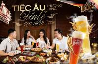 a group of people sitting around a table with beer at Happiest Homestay 1 - Manor Crown Hue in Hue