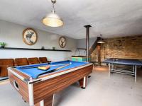 a room with a pool table and a ping pong ball at Fancy Holiday Home in Sainte C cile with Pool House Indoor Pool in Sainte-Cécile