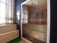 a shower with a glass door in a room at Fancy Holiday Home in Sainte C cile with Pool House Indoor Pool in Sainte-Cécile