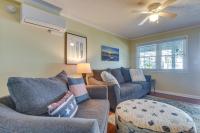ein Wohnzimmer mit 2 Sofas und einem Deckenventilator in der Unterkunft Steps to Ocean North Myrtle Beach Condo with Porch! in Myrtle Beach