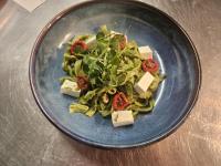 a blue plate of food with pasta and cheese at Greenfield Lodge Hotel Bar & Bistro in Headford