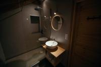 a bathroom with a sink and a mirror at La Ferme du Bien-etre in Saint-Julien-Chapteuil