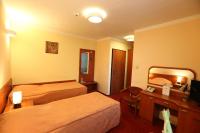 Posteľ alebo postele v izbe v ubytovaní Hotel Korona