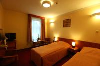 Posteľ alebo postele v izbe v ubytovaní Hotel Korona