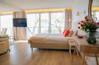 Hotel Szerokie Wody Sea & Sand Ustkaにあるベッド