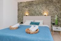 Posteľ alebo postele v izbe v ubytovaní Amarylis Beachfront Studios