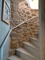 a stone wall and stairs in a house at Le 1 St Yves Studios in Tréguier