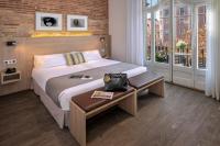 A bed or beds in a room at Hotel SERHS Rivoli Rambla