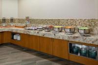 a kitchen with pots and pans on a counter at DoubleTree by Hilton Kansas City - Overland Park in Overland Park