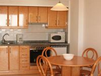 A kitchen or kitchenette at Apartamentos Ambar Beach Unitursa