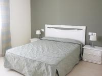 A bed or beds in a room at Apartamentos Ambar Beach Unitursa