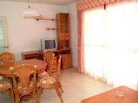 A television and/or entertainment centre at Apartamentos Ambar Beach Unitursa