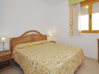 A bed or beds in a room at Apartamentos Ambar Beach Unitursa