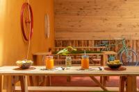 a wooden table with drinks on top of it at Banana Farm Eco Hostel in Arusha