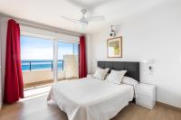 A bed or beds in a room at BEACHFRONT -- NEW LUXURY Apartment -- 1ª Linea Playa -- Fuengirola CITY CENTER -- Private PARKING -- Panoramic Sea Views --