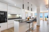 A kitchen or kitchenette at BEACHFRONT -- NEW LUXURY Apartment -- 1ª Linea Playa -- Fuengirola CITY CENTER -- Private PARKING -- Panoramic Sea Views --