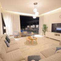 TV a/nebo společenská místnost v ubytování The Ocean Villa