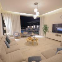 TV a/nebo společenská místnost v ubytování The Ocean Villa