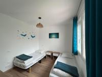 Łóżko lub łóżka w pokoju w obiekcie Maison idéalement située pour les vacances