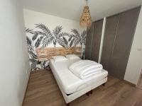 Łóżko lub łóżka w pokoju w obiekcie Maison idéalement située pour les vacances