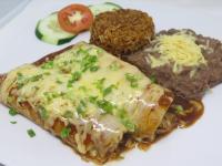 a plate of food with meat and cheese and vegetables at Badladz Beach and Dive Resort in Puerto Galera
